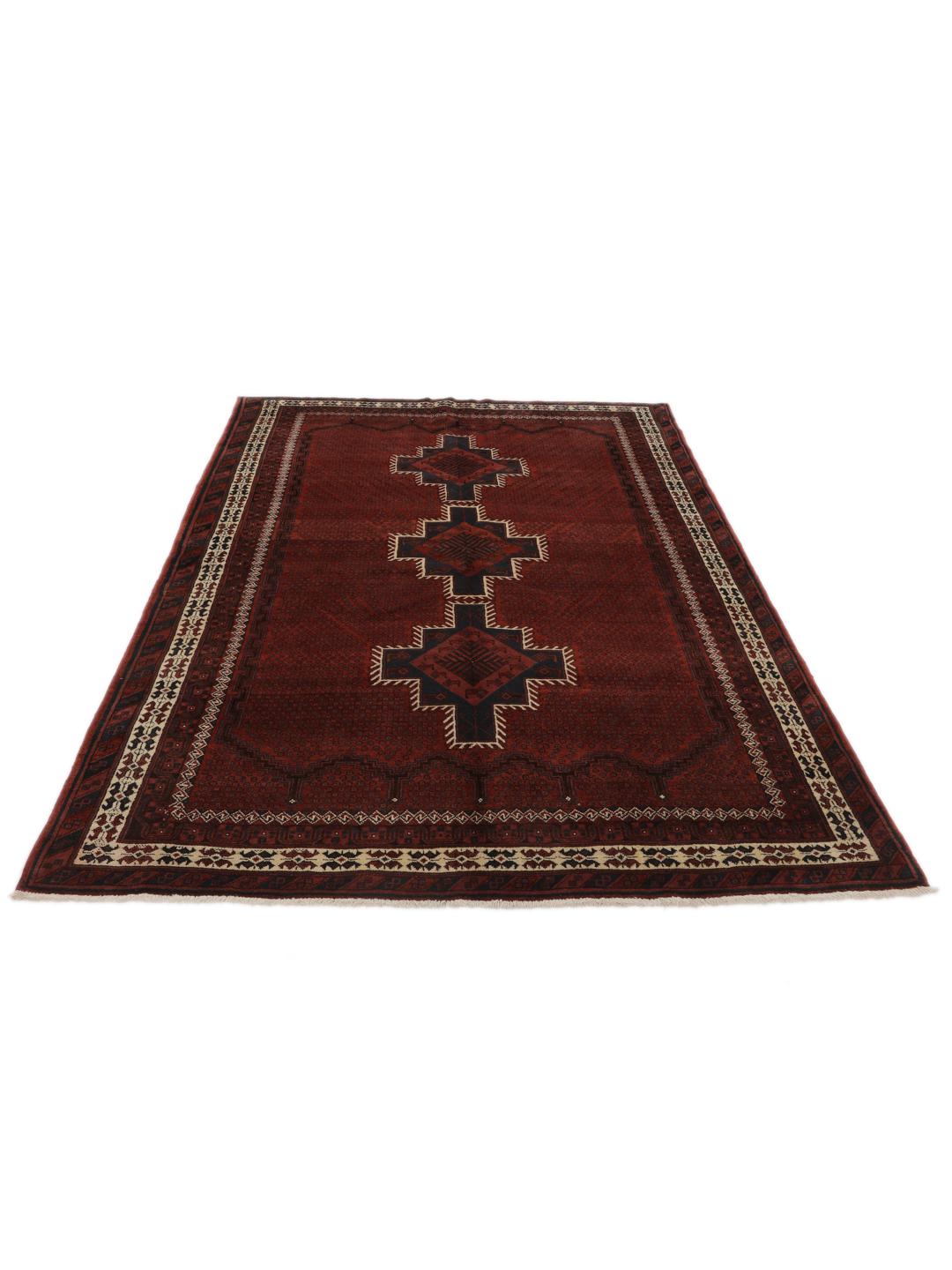 A hand-knotted Afshar rug from the Middle East in deep red featuring geometric medallions.