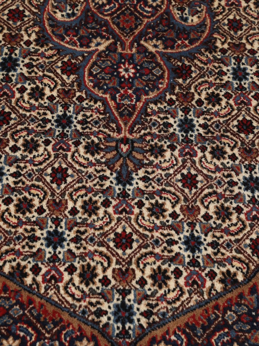 Hand-knotted Moud rug from the Middle East in dark-red and blue