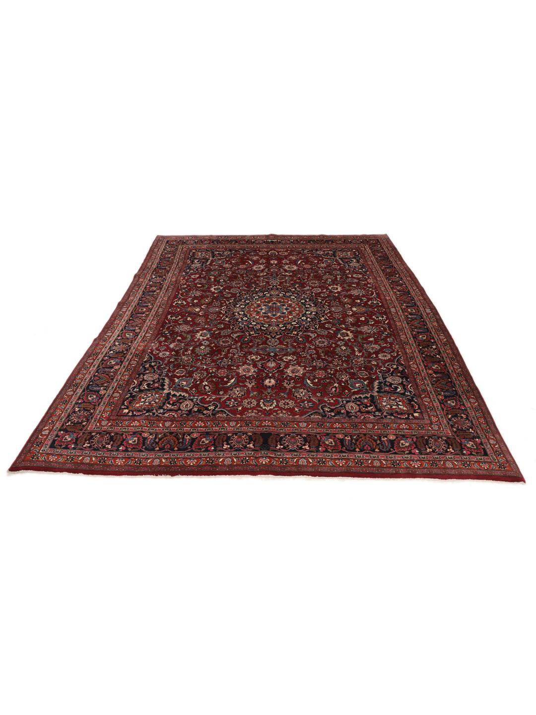 Hand-knotted Mashad rug from the Middle East in deep dark-red with floral pattern