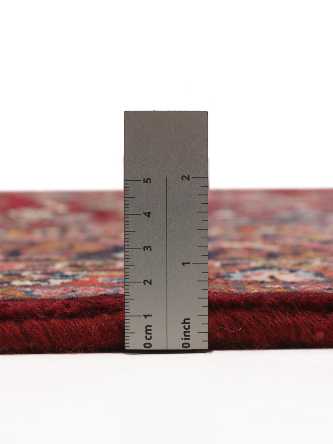 Hand-knotted Mashad rug from the Middle East in deep dark-red with floral pattern