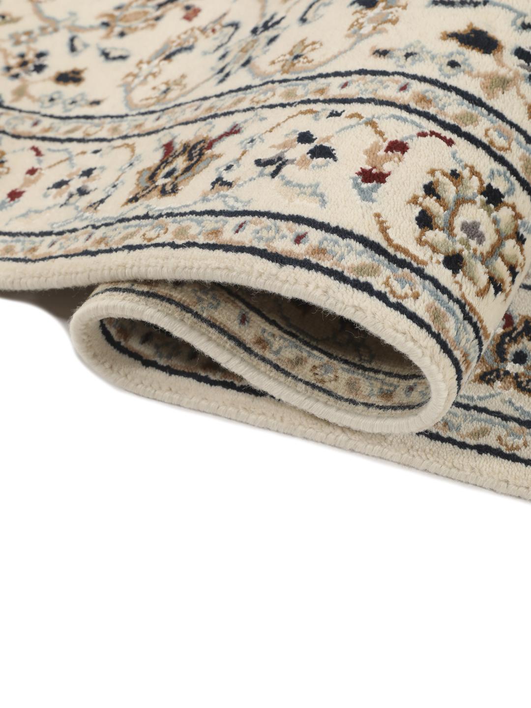 Met de hand geknoopte beige Nain loper uit India met bloemmotieven