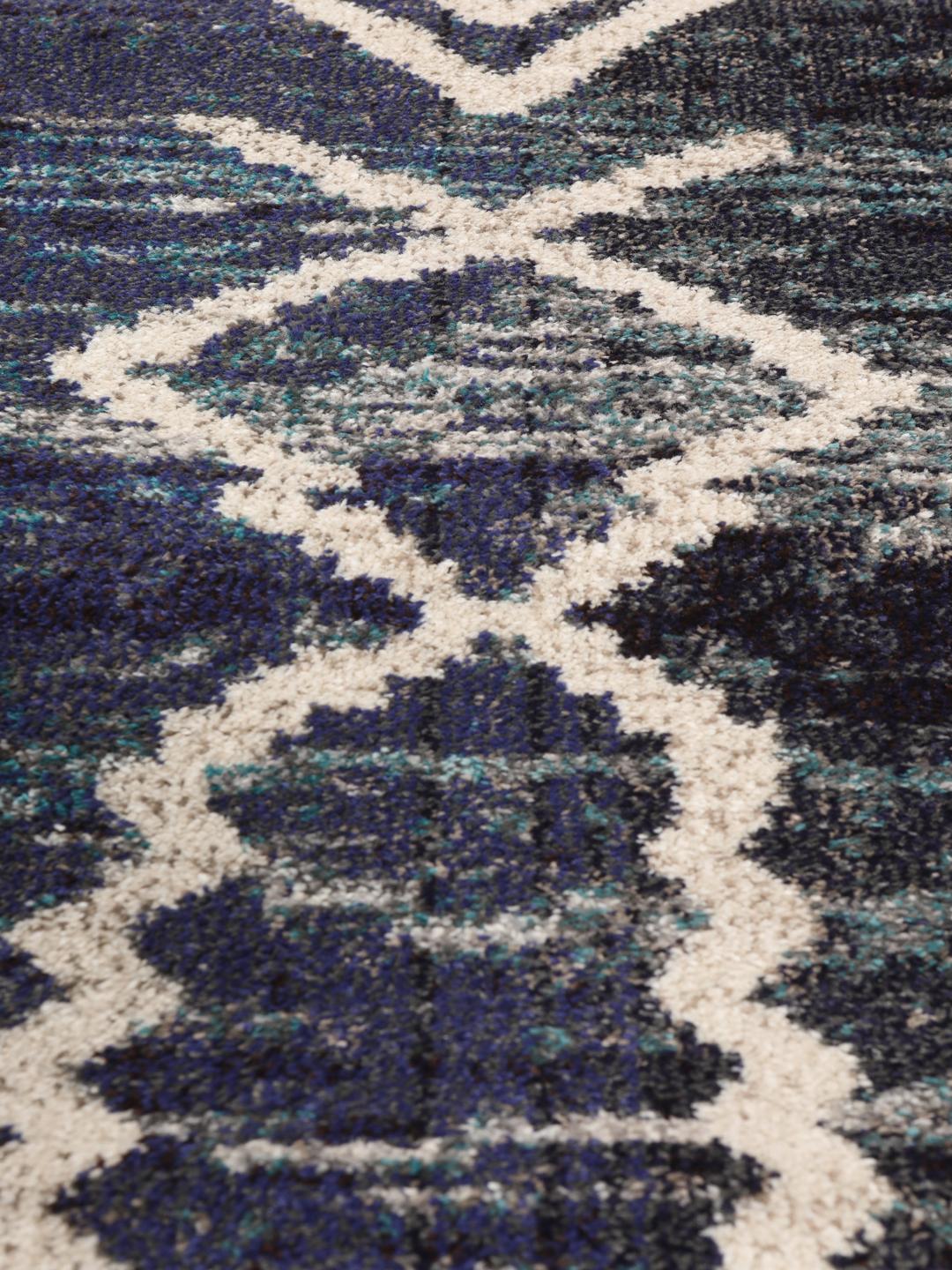 Blauw tapijt met abstracte witte lijnpatronen