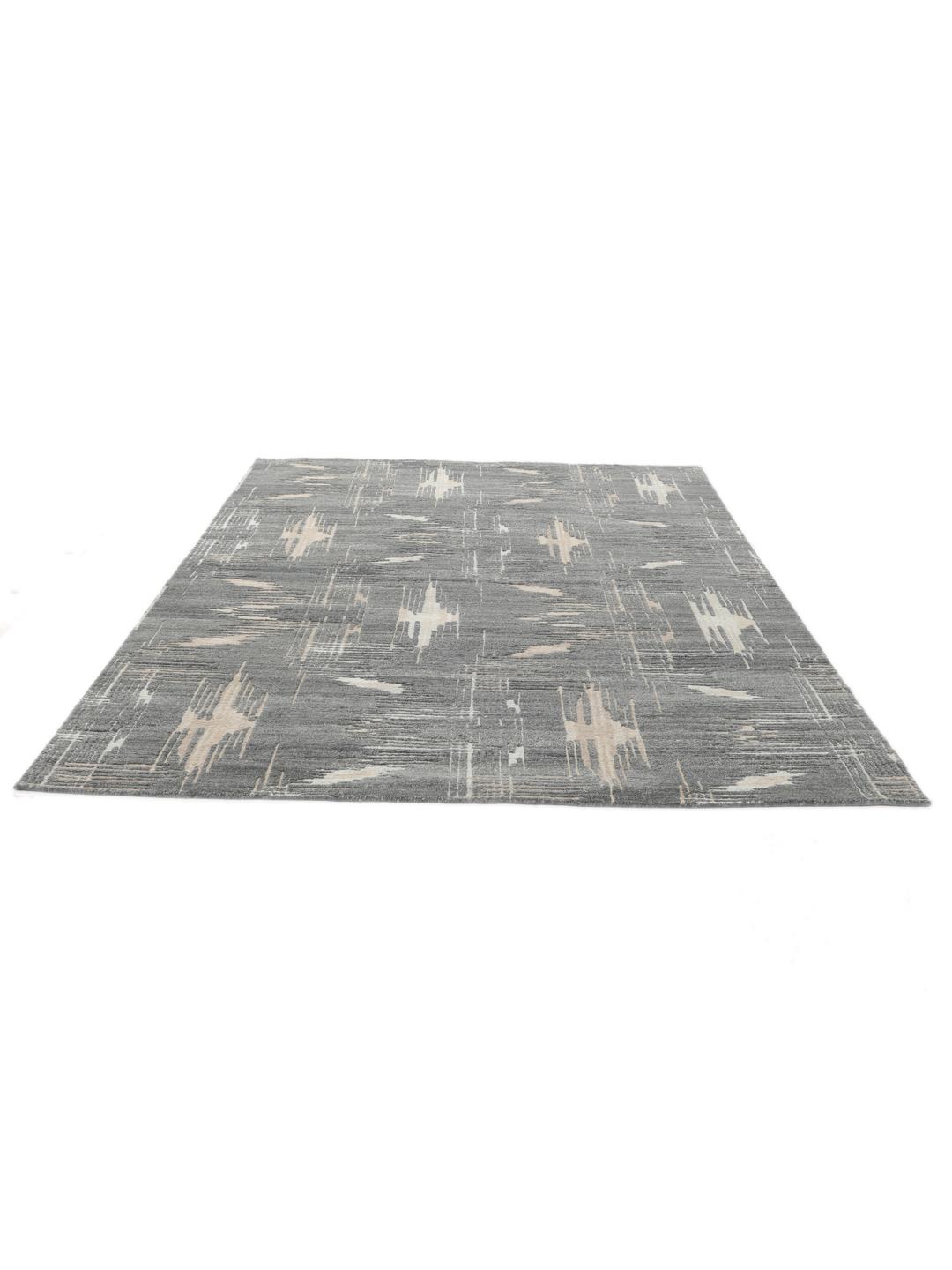 Handgeknoopt wollen tapijt uit India met een abstract design in grijs en beige