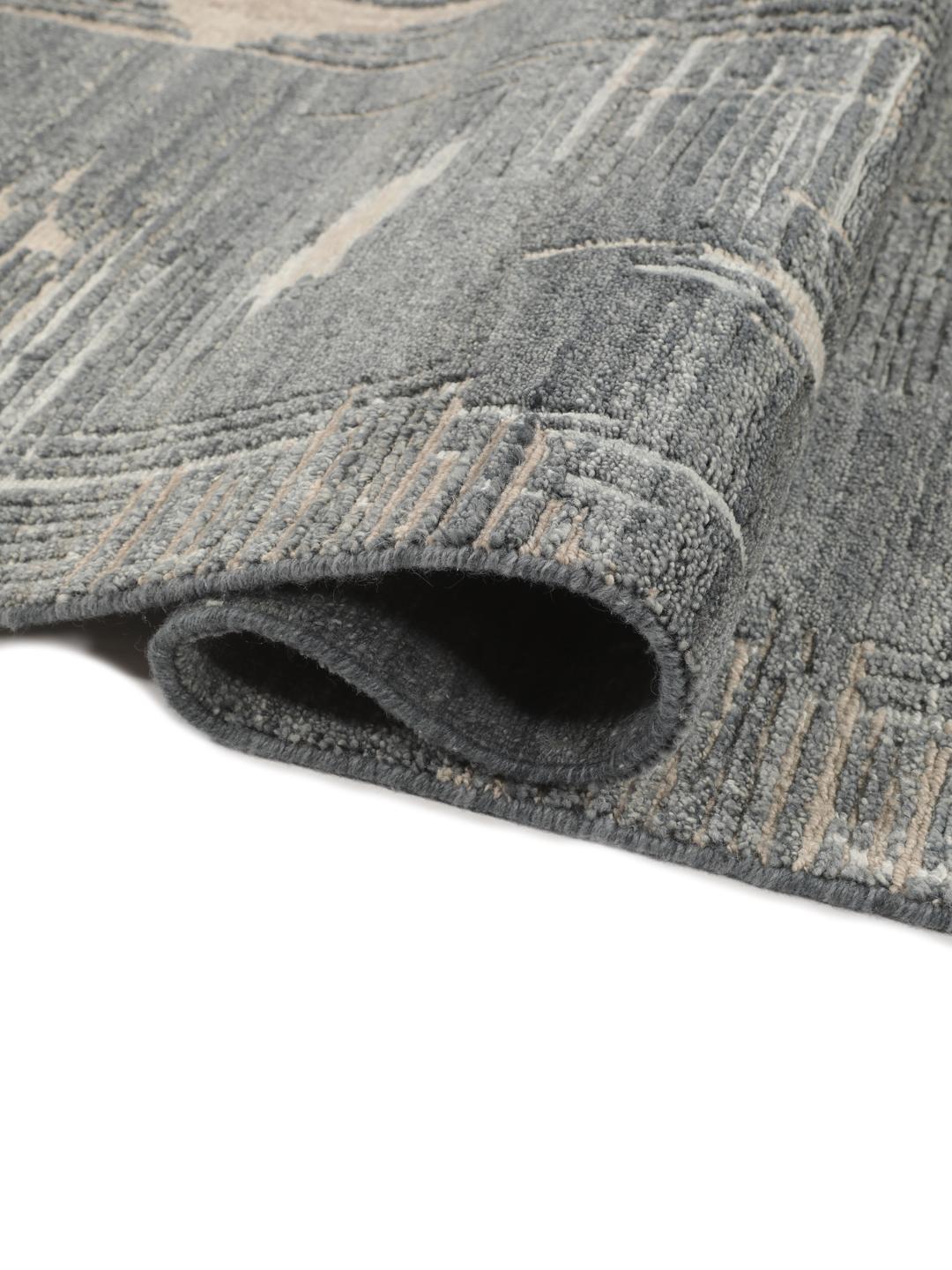 Handgeknoopt wollen tapijt uit India met een abstract design in grijs en beige