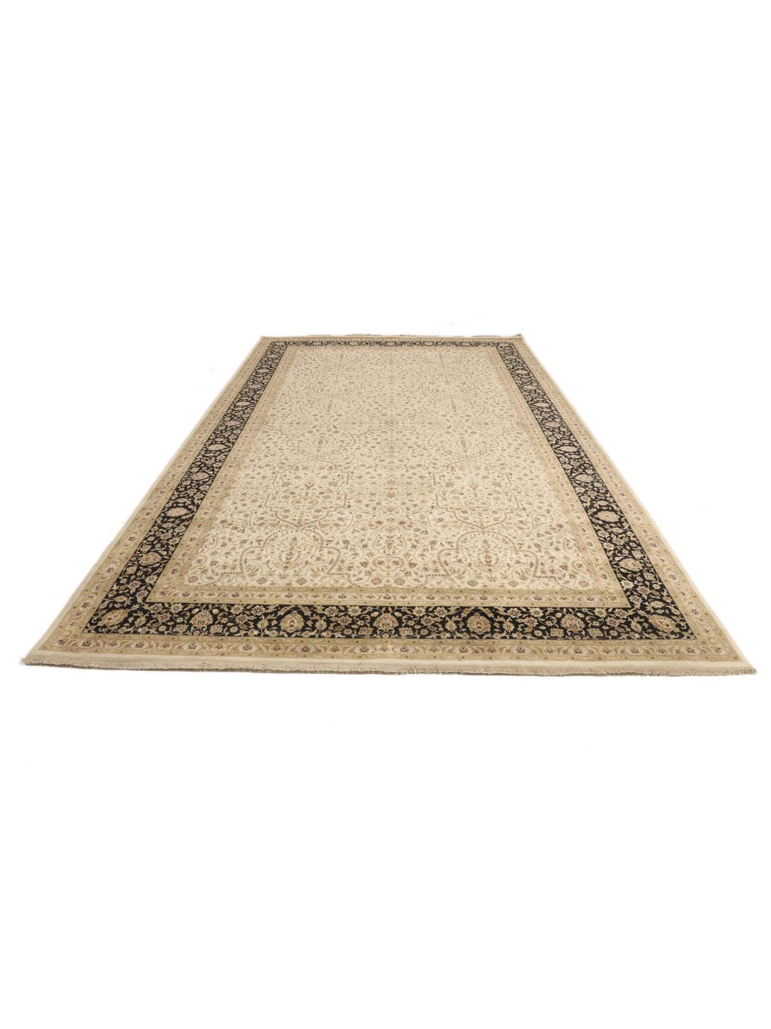 A large, hand-knotted Sarough rug from India featuring an intricate floral design on a beige field with a black border.