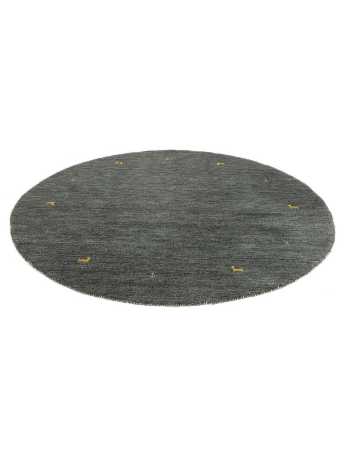 Rond vloerkleed met een donkergroene basis en gele diermotieven