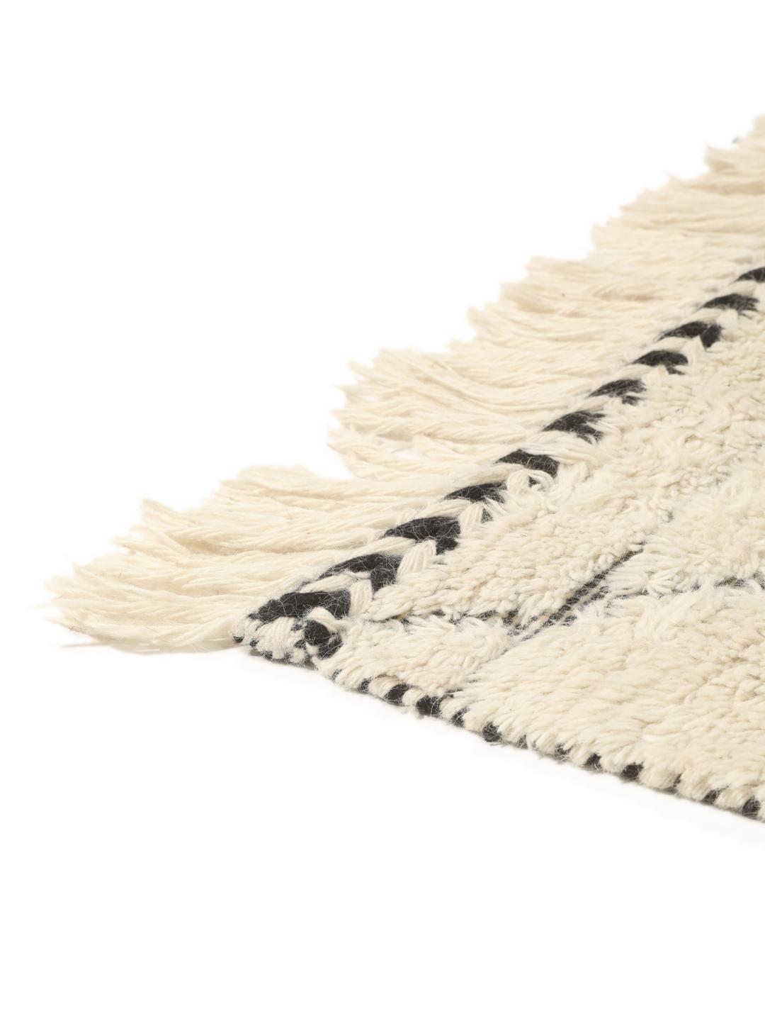 Beige vloerkleed met ruitpatronen en franjes