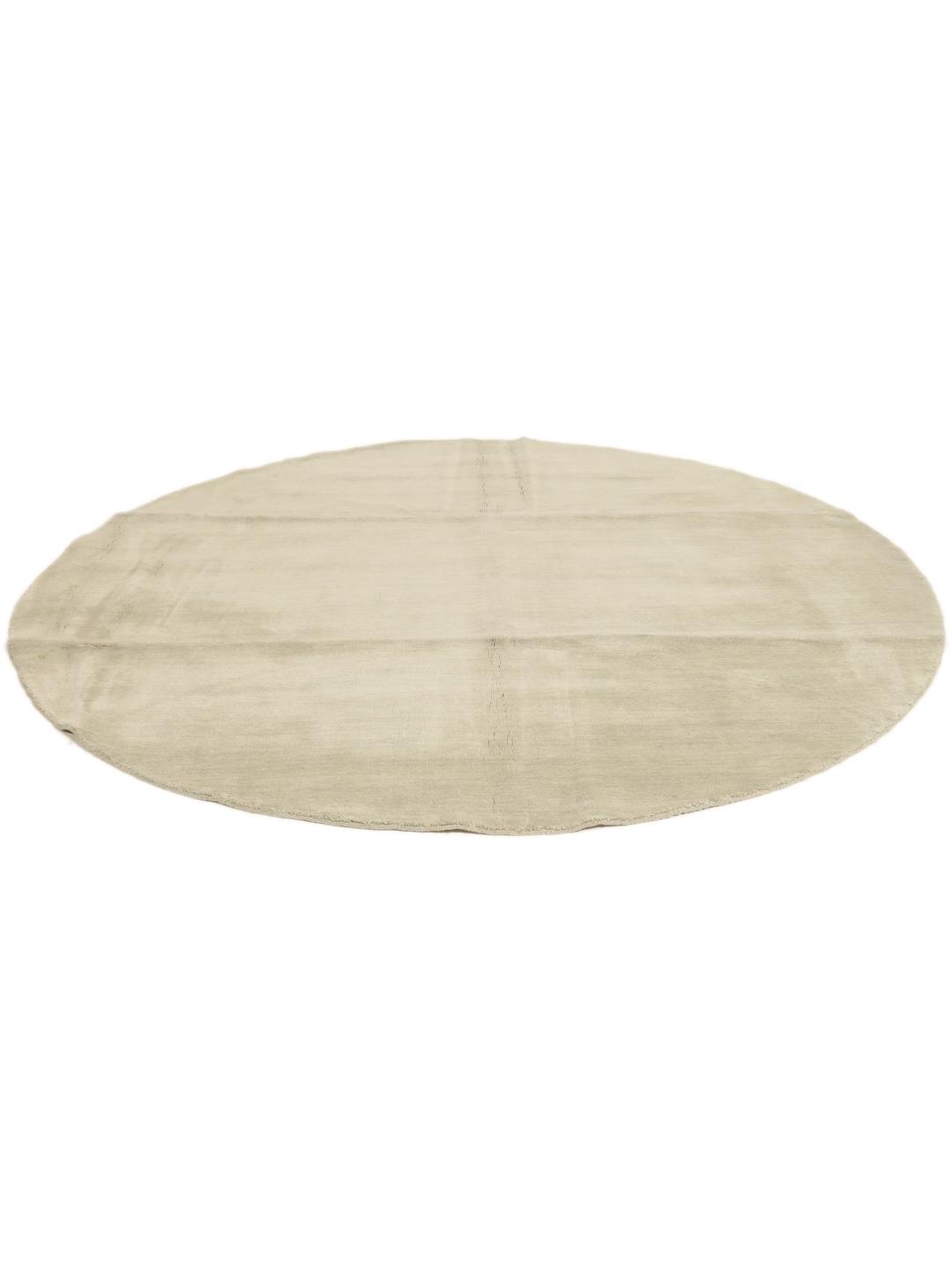 Rond beige tapijt met een zacht, minimalistisch oppervlak