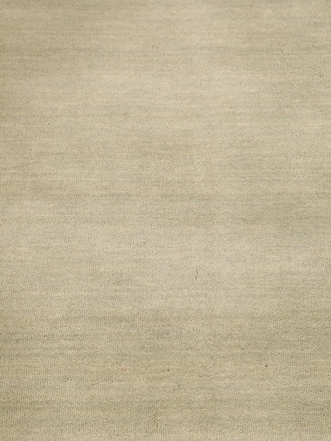 Rond beige tapijt met een zacht, minimalistisch oppervlak