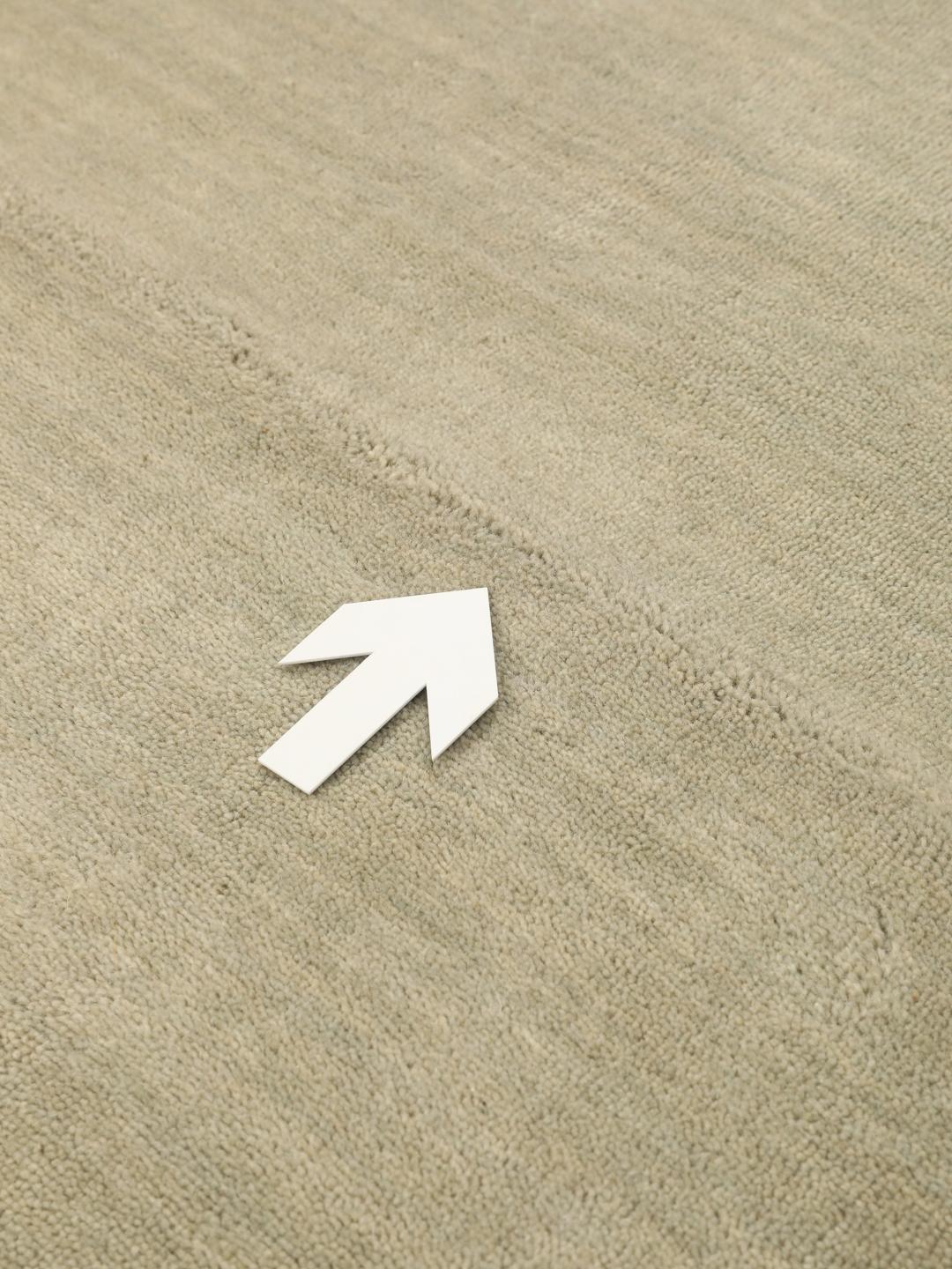 Rond beige tapijt met een zacht, minimalistisch oppervlak