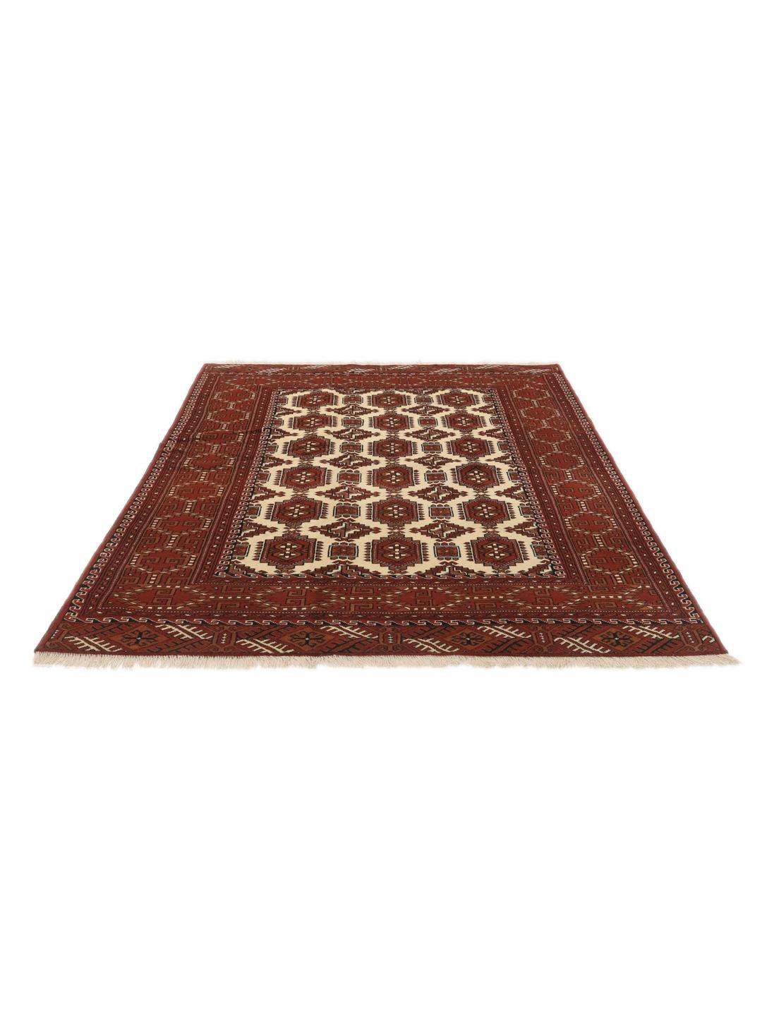 Hand-knotted Turkaman rug from the Middle East in red and cream tones