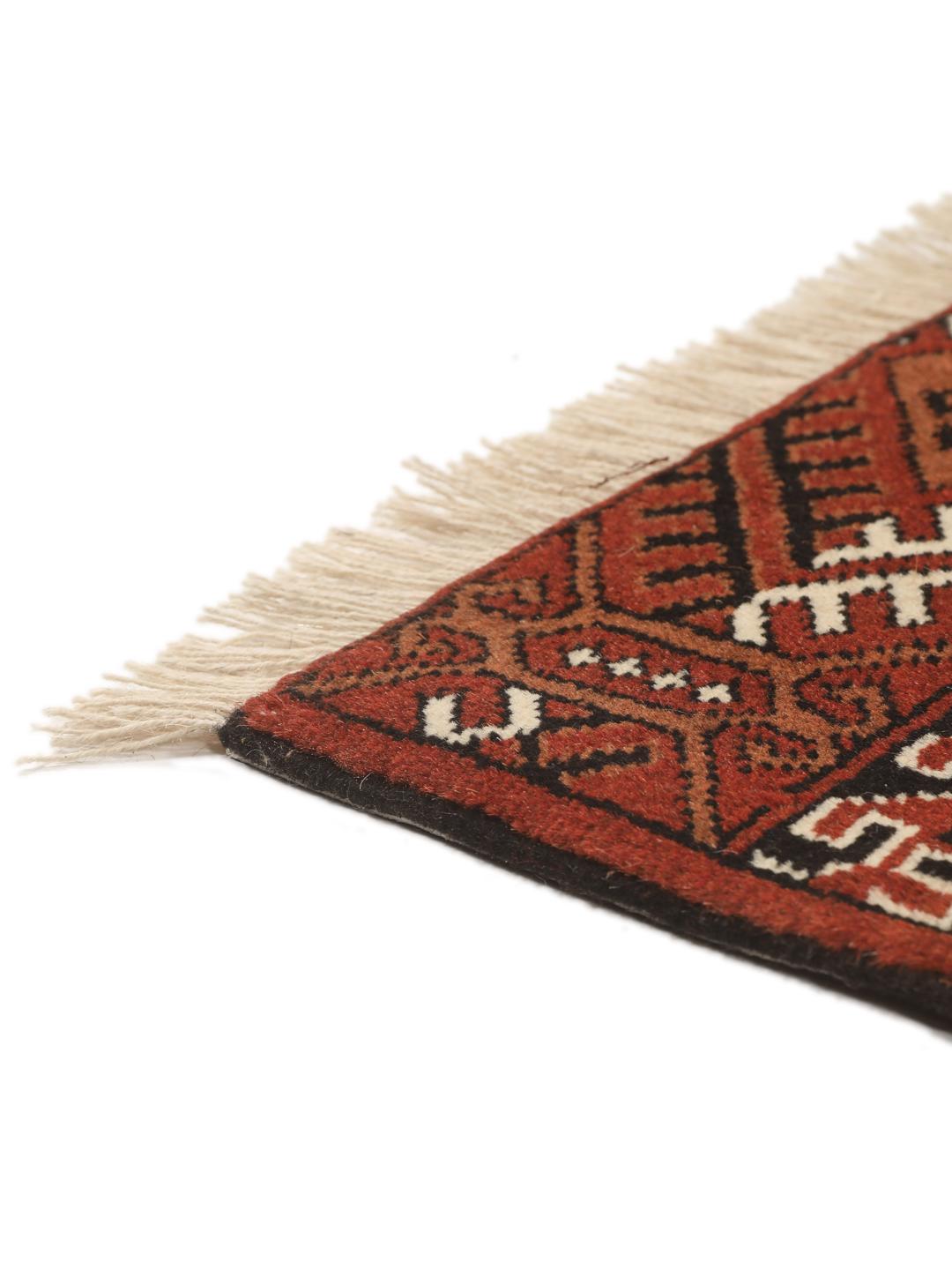 Hand-knotted Turkaman rug from the Middle East in red and cream tones
