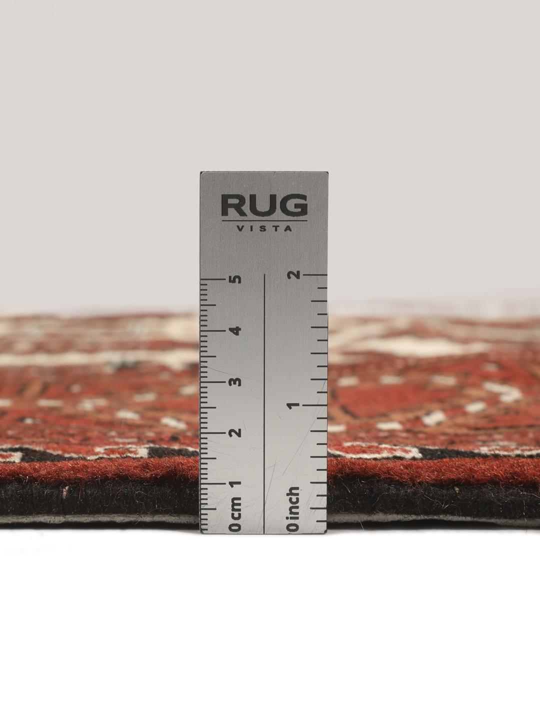 Hand-knotted Turkaman rug from the Middle East in red and cream tones