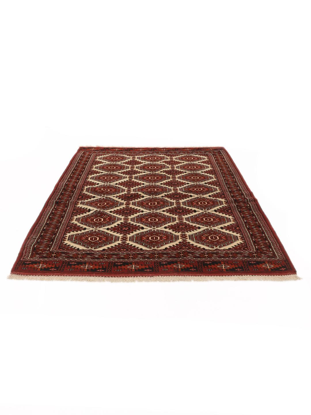 Hand-knotted Turkaman rug from the Middle East in red and black