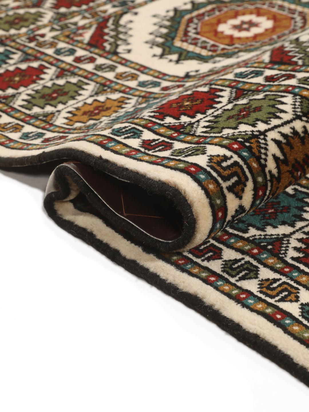 Hand-knotted Turkaman rug from the Middle East in red and beige tones.