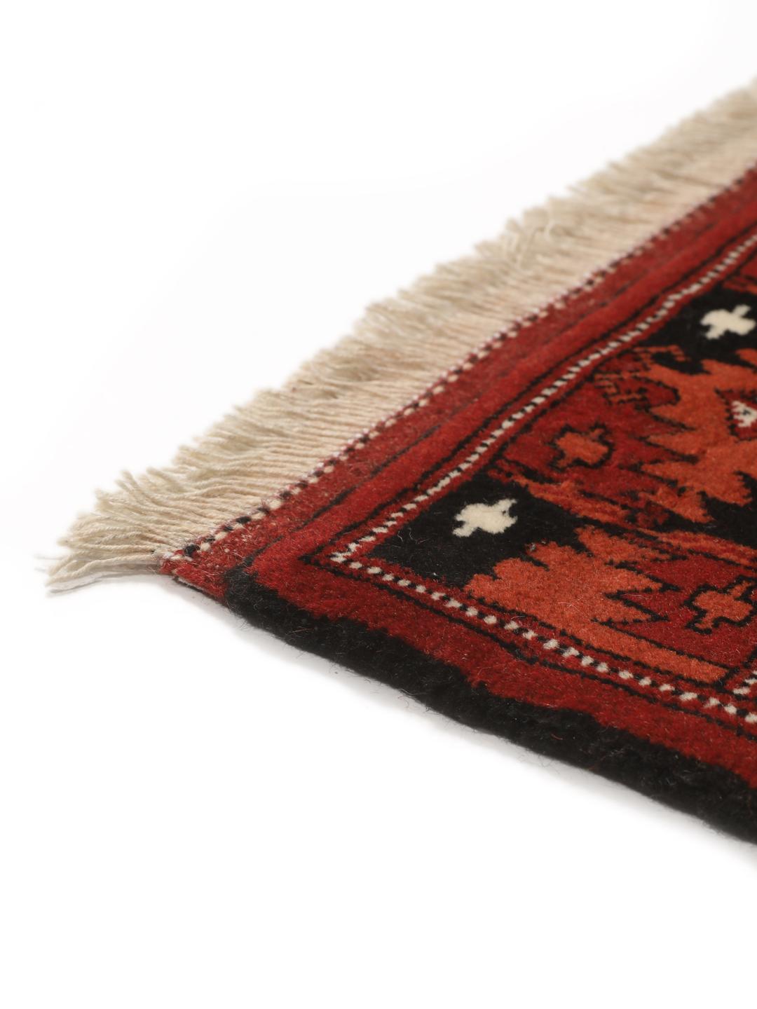 Hand-knotted Turkaman rug from the Middle East in shades of red and beige