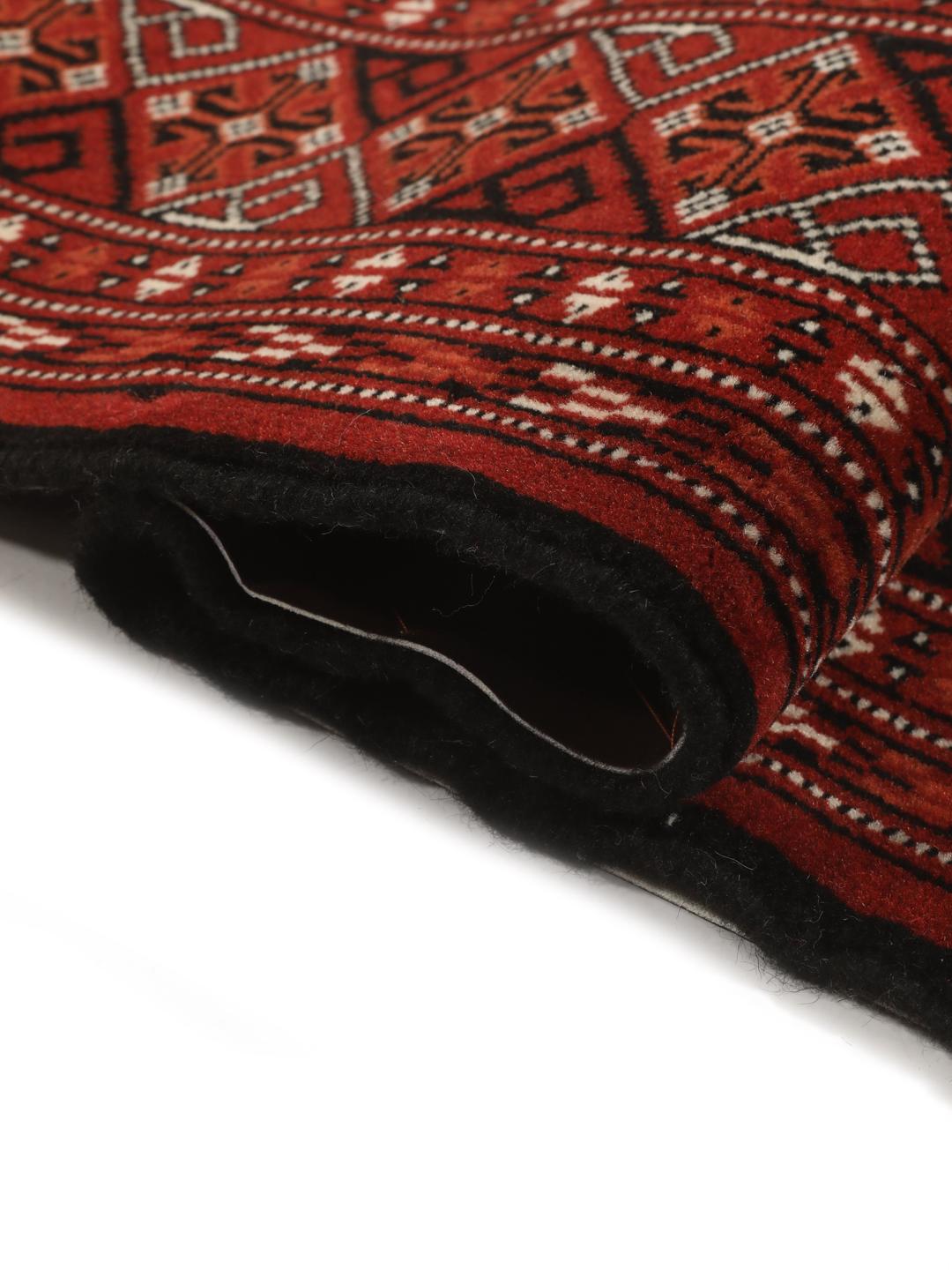 Hand-knotted Turkaman rug from the Middle East in shades of red and beige