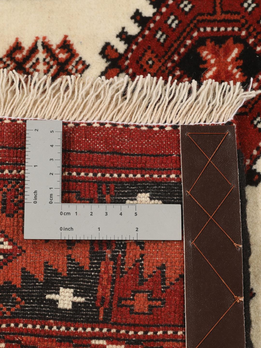 Hand-knotted Turkaman rug from the Middle East in shades of red and beige
