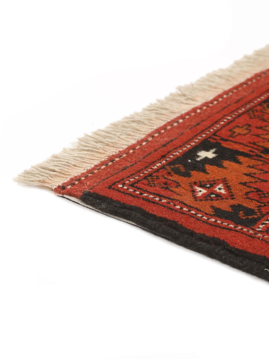 Hand-knotted Turkaman rug from the Middle East in deep red tones