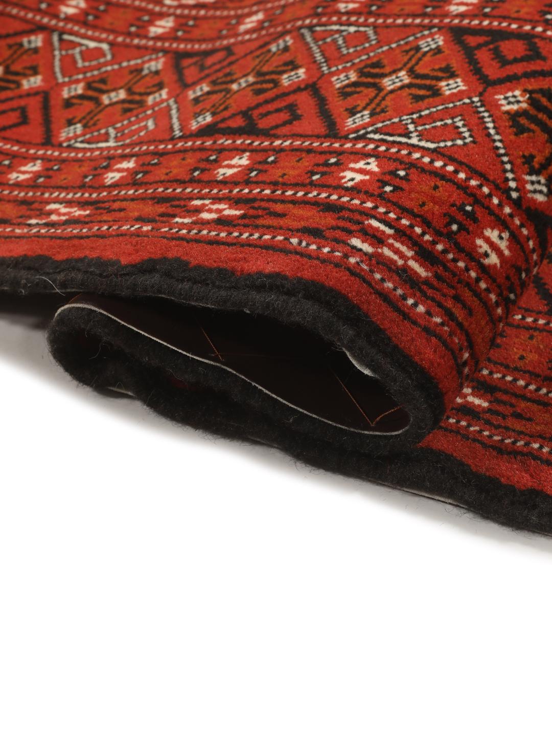 Hand-knotted Turkaman rug from the Middle East in deep red tones