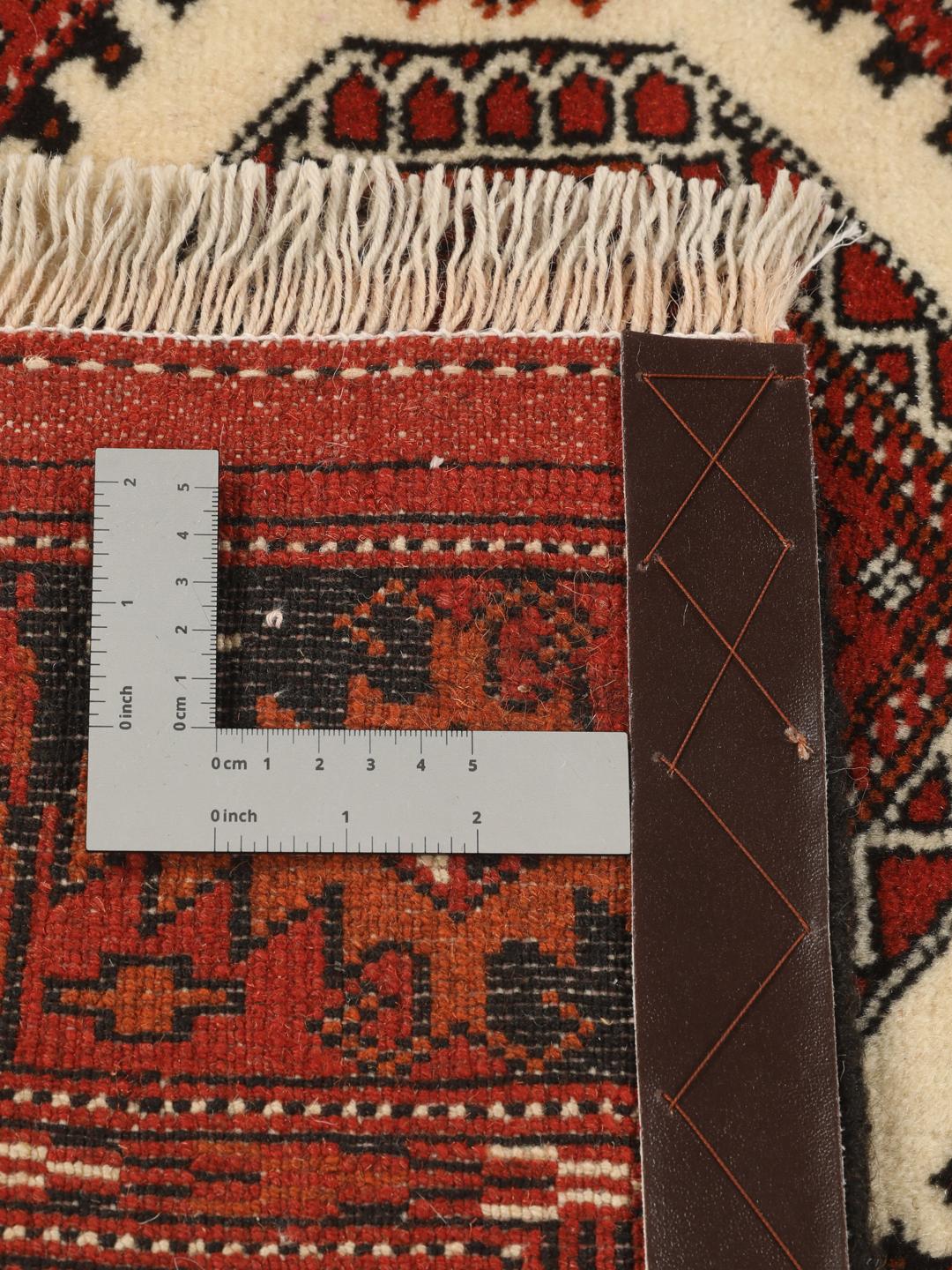 Hand-knotted Turkaman rug from the Middle East in deep red tones