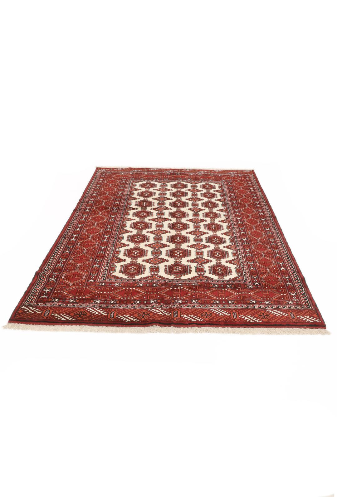 Hand-knotted Turkaman rug with a deep red field and geometric motifs