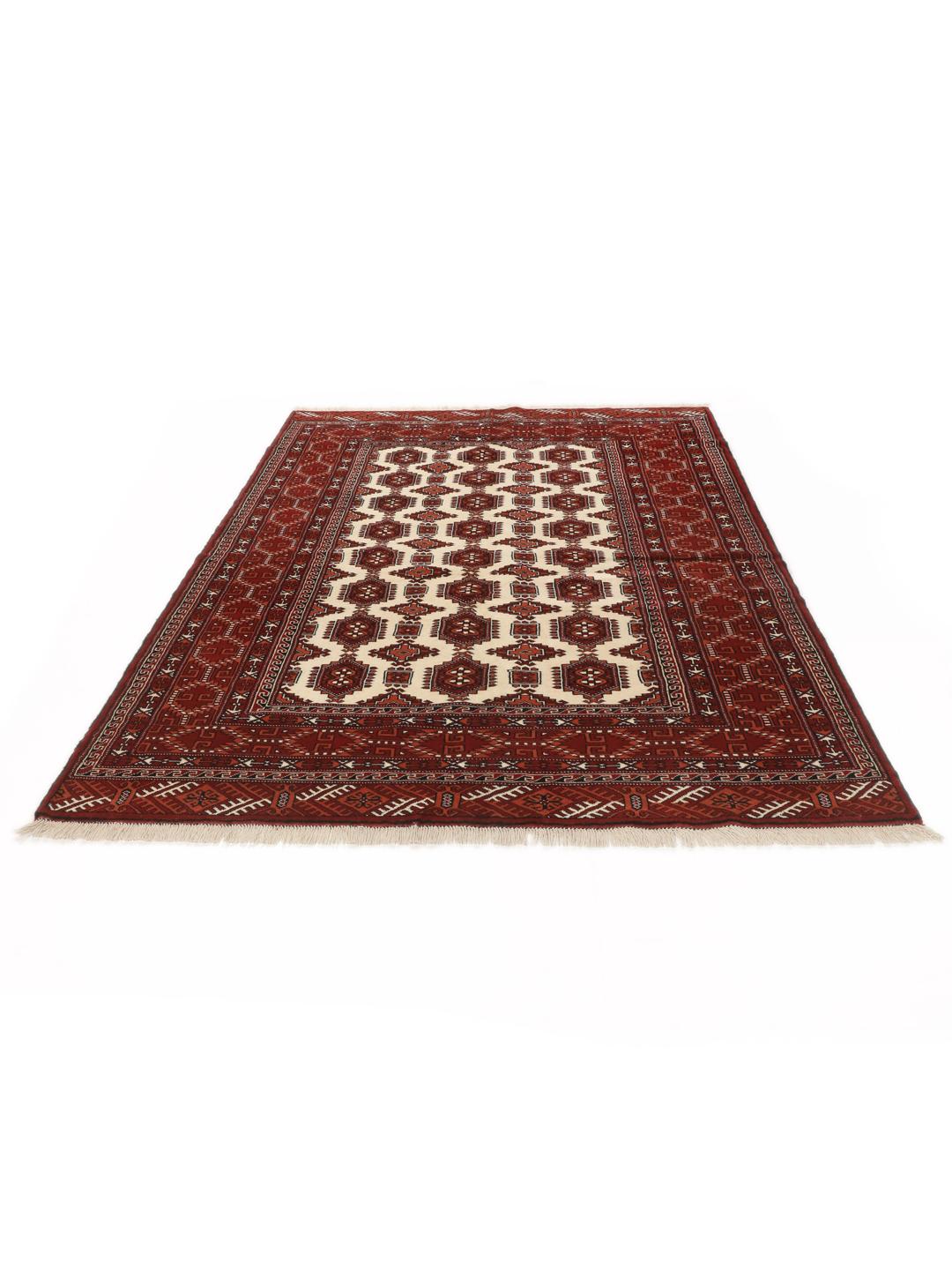 Hand-knotted Turkaman rug with a deep red field and geometric motifs