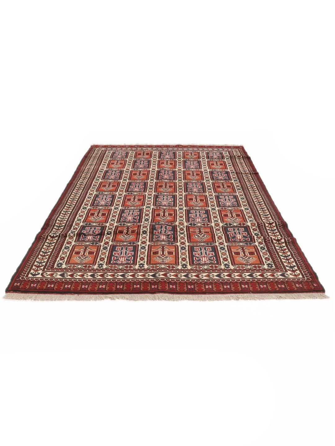 Hand-knotted Turkaman rug from the Middle East in red tones.