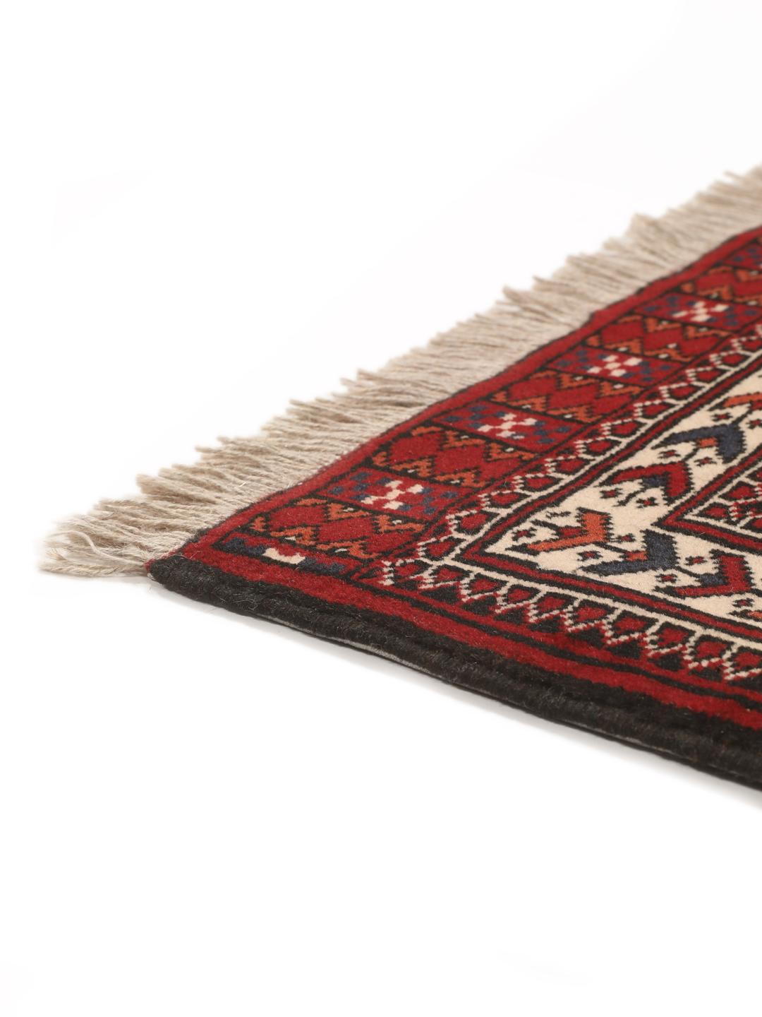 Hand-knotted Turkaman rug from the Middle East in red tones.