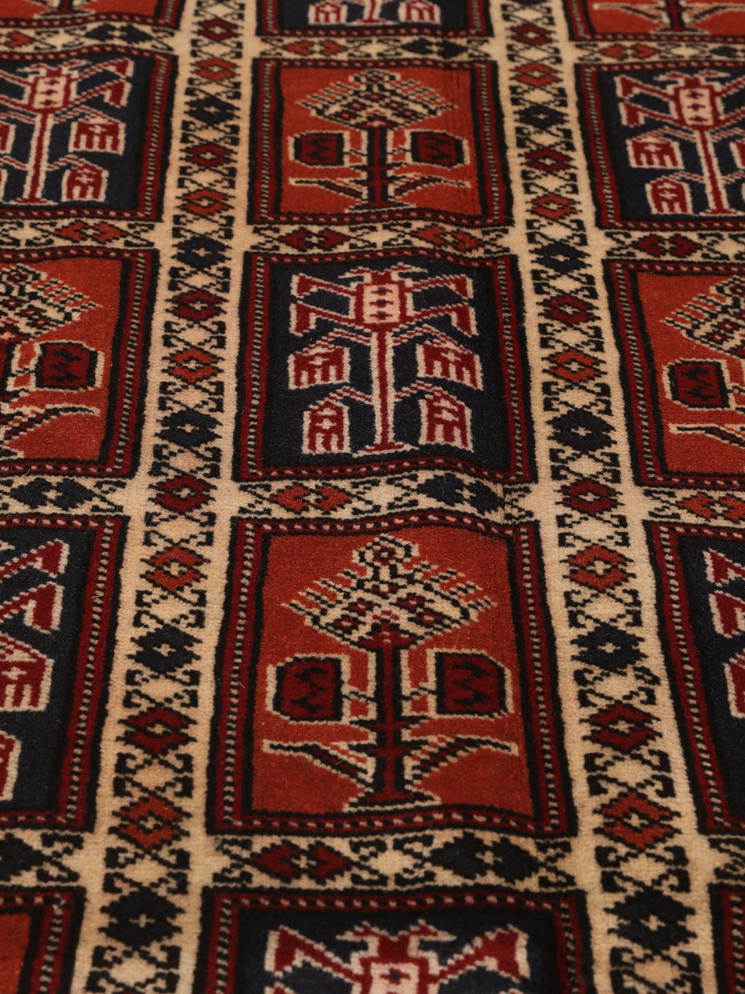 Hand-knotted Turkaman rug from the Middle East in red tones.