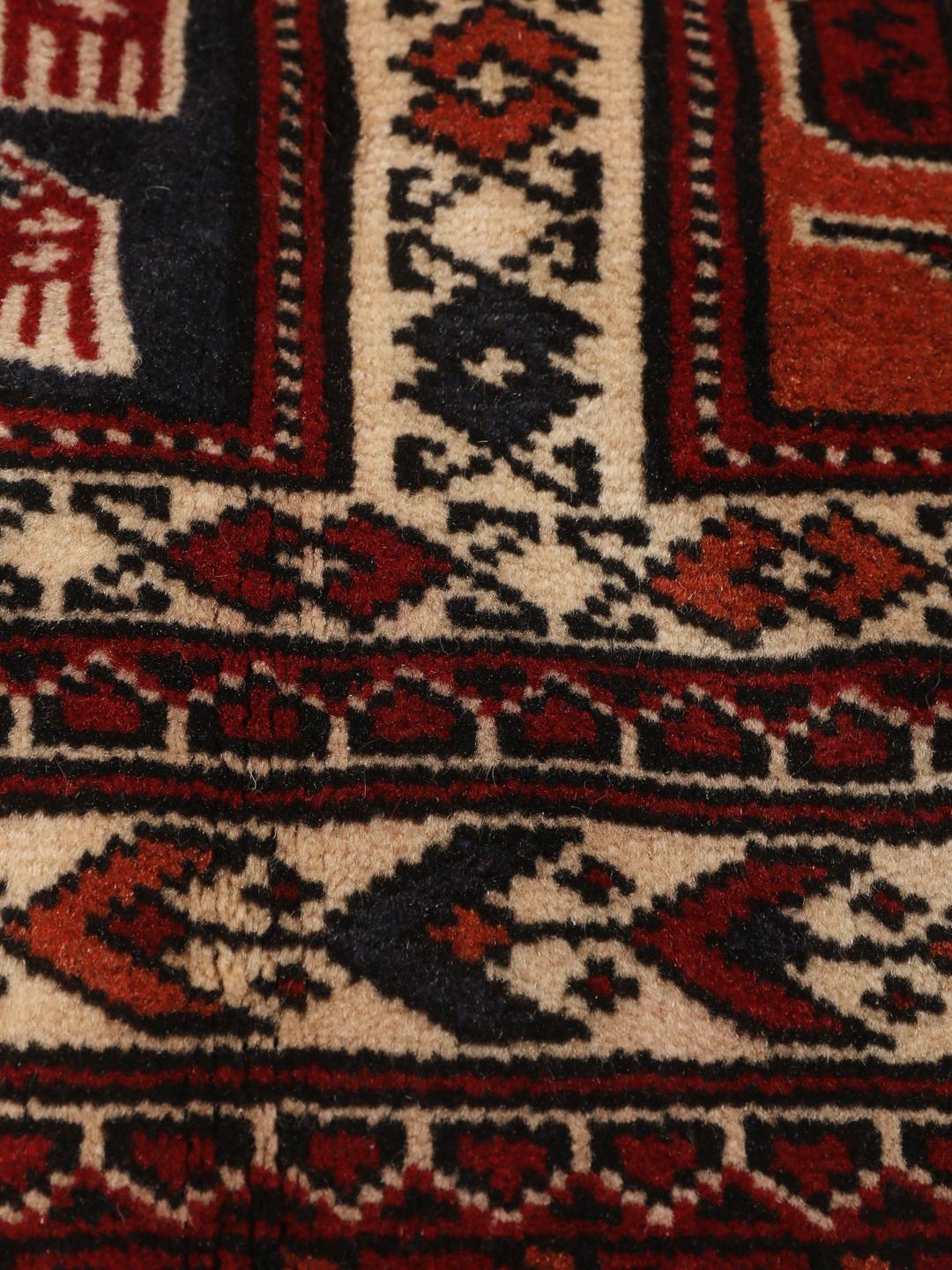 Hand-knotted Turkaman rug from the Middle East in red tones.
