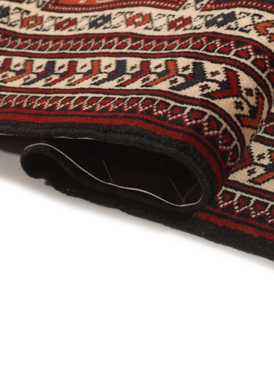 Hand-knotted Turkaman rug from the Middle East in red tones.
