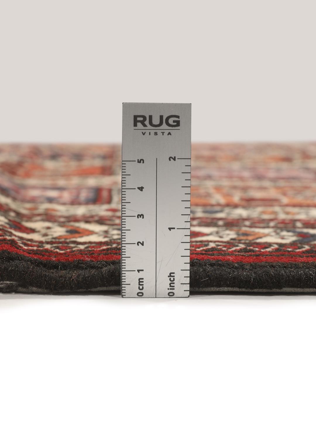Hand-knotted Turkaman rug from the Middle East in red tones.
