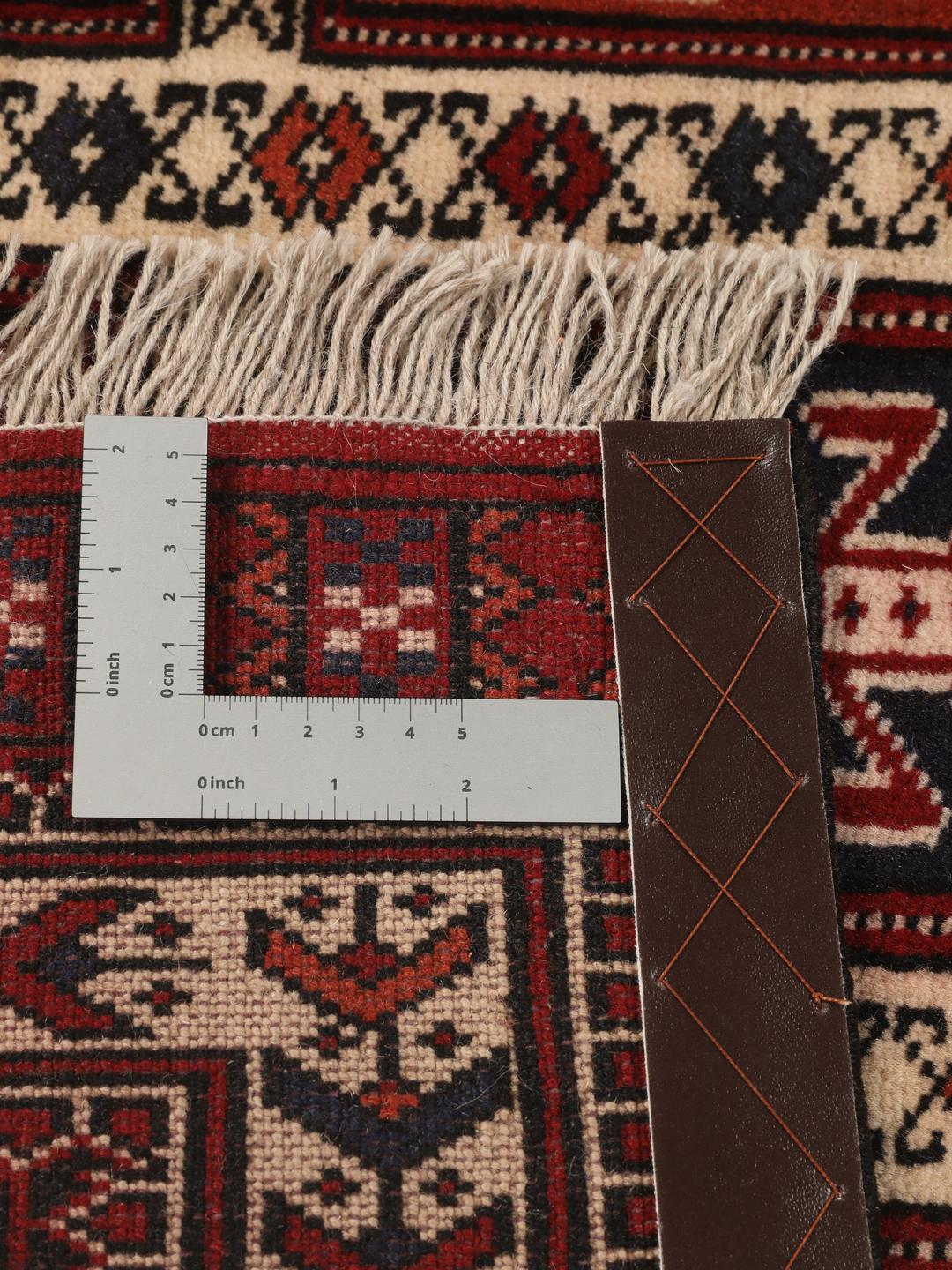 Hand-knotted Turkaman rug from the Middle East in red tones.