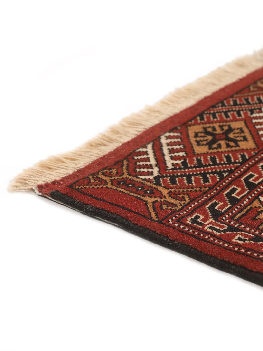 Hand-knotted Turkaman Wool rug with geometric patterns in red and beige from the Middle East.