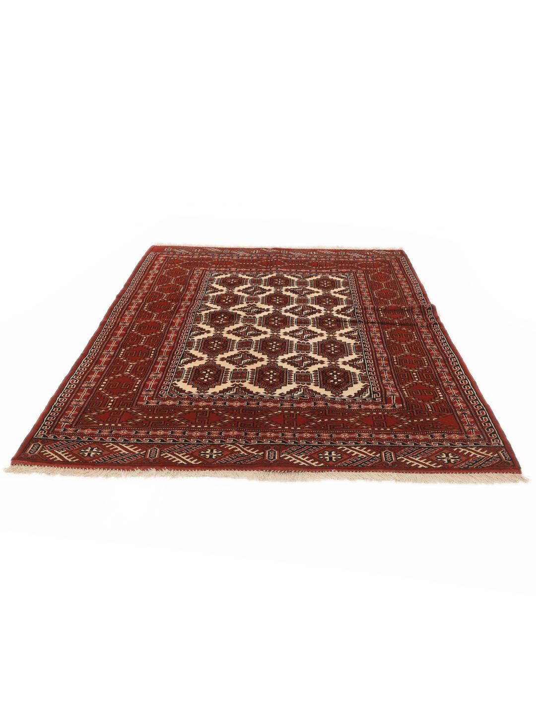 A hand-knotted, one-of-a-kind Turkaman rug with a red field and traditional geometric motifs.