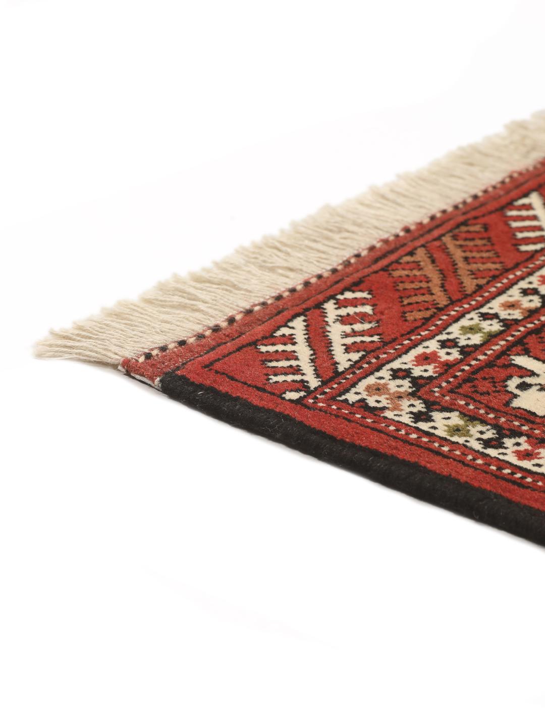 Hand-knotted Turkaman Wool rug from the Middle East in red and cream