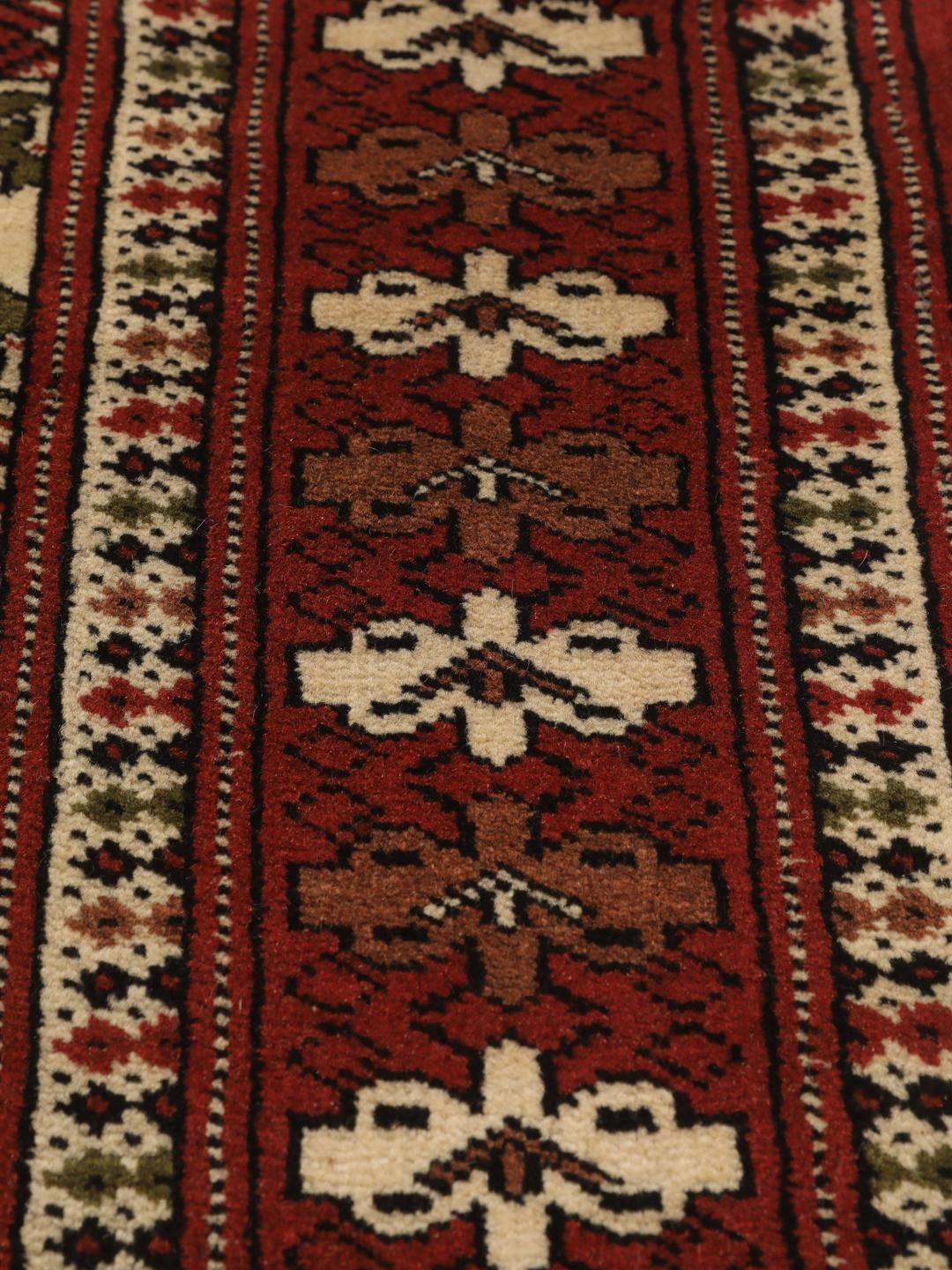 Hand-knotted Turkaman Wool rug from the Middle East in red and cream
