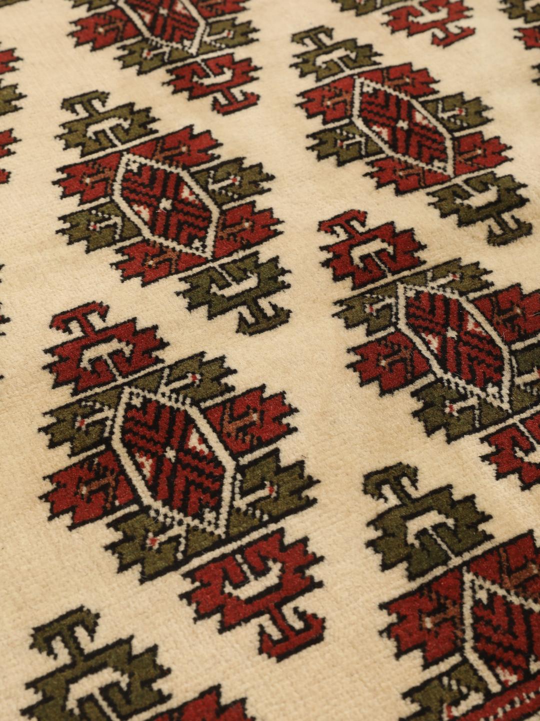 Hand-knotted Turkaman Wool rug from the Middle East in red and cream