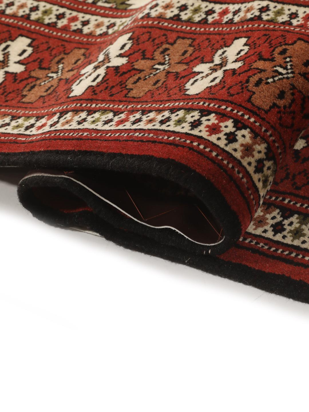Hand-knotted Turkaman Wool rug from the Middle East in red and cream