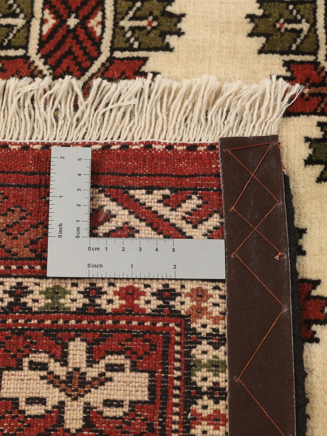 Hand-knotted Turkaman Wool rug from the Middle East in red and cream