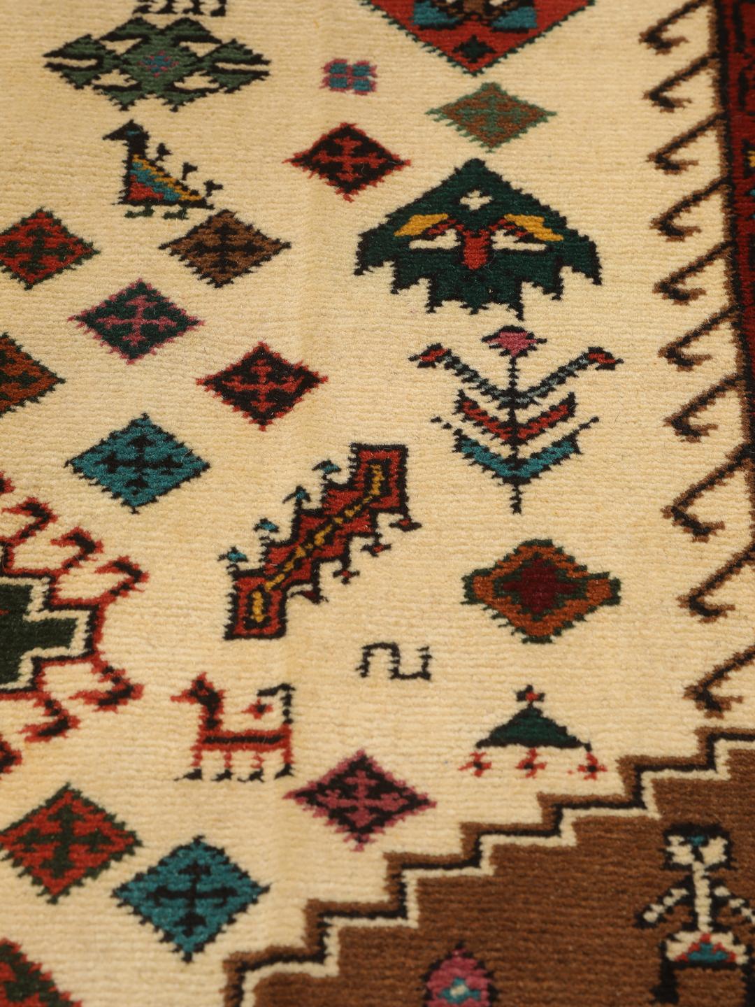 Hand-knotted Turkaman rug from the Middle East featuring a red and beige geometric pattern