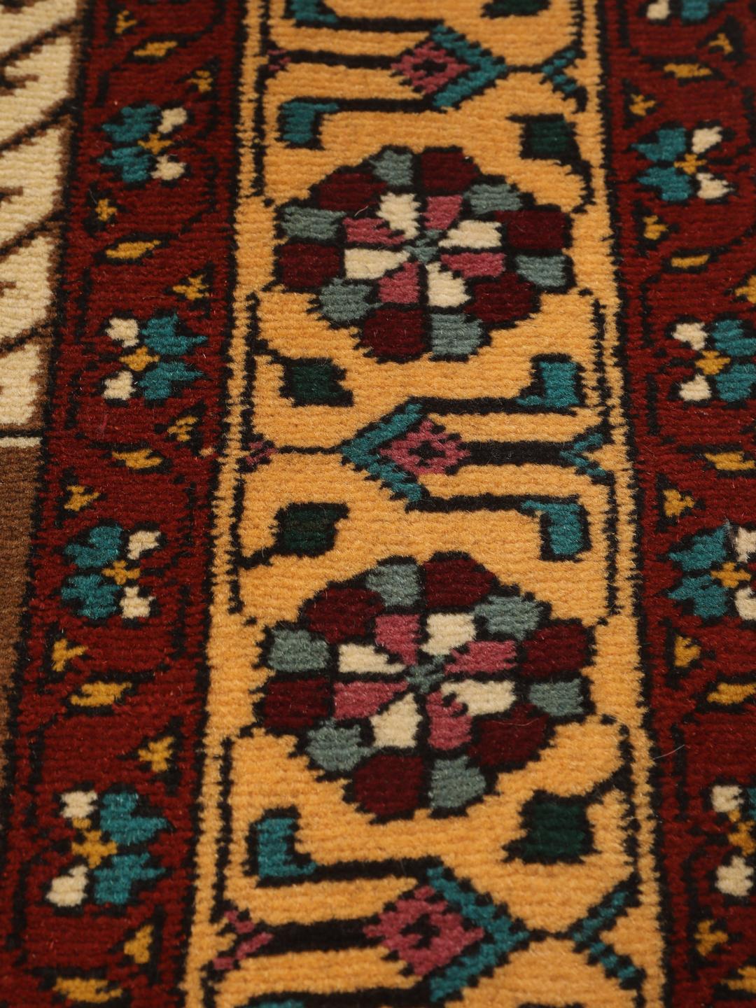 Hand-knotted Turkaman rug from the Middle East featuring a red and beige geometric pattern