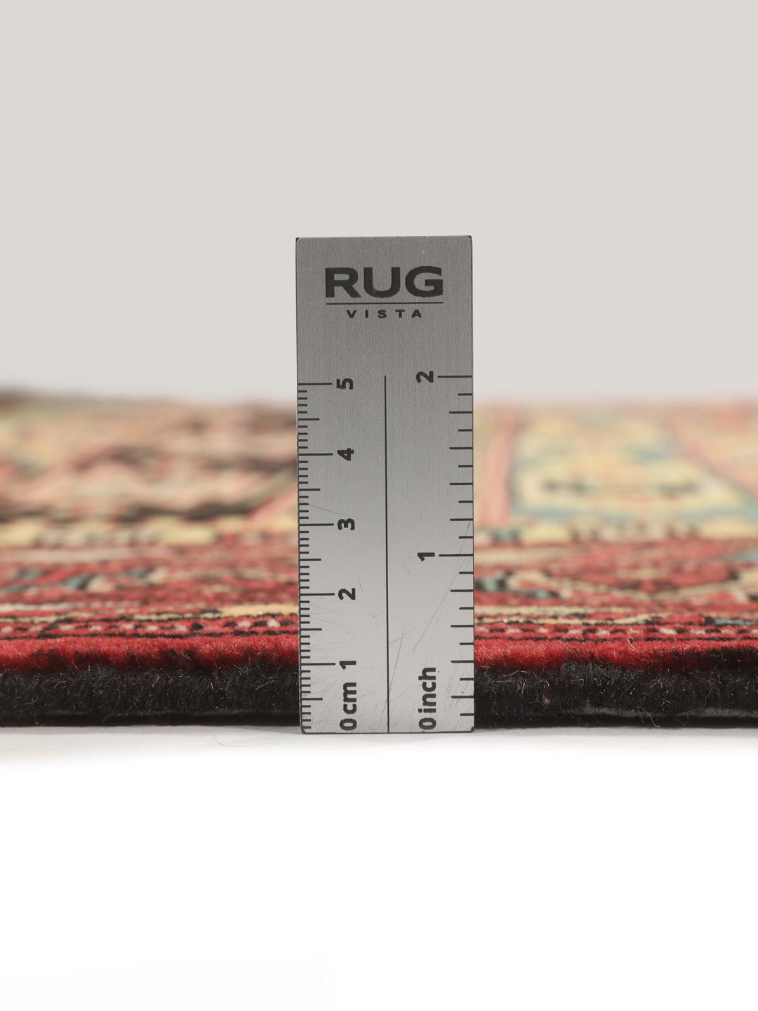 Hand-knotted Turkaman rug from the Middle East in vibrant red and geometric patterns