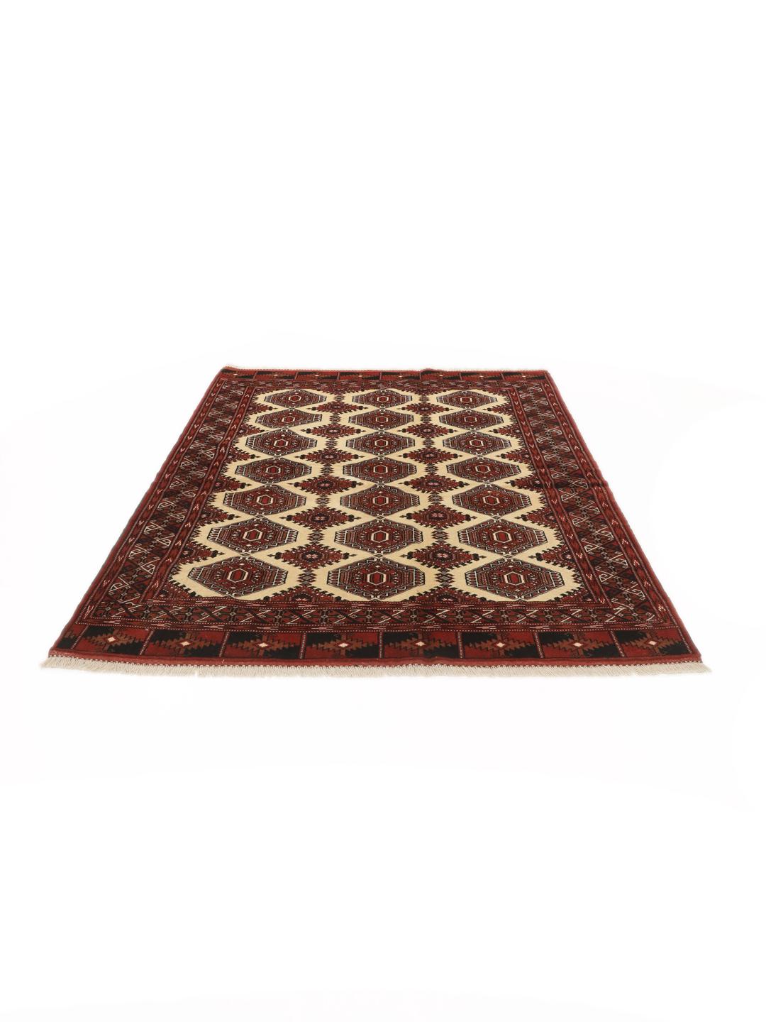 Hand-knotted Turkaman rug from the Middle East in deep red and beige tones.