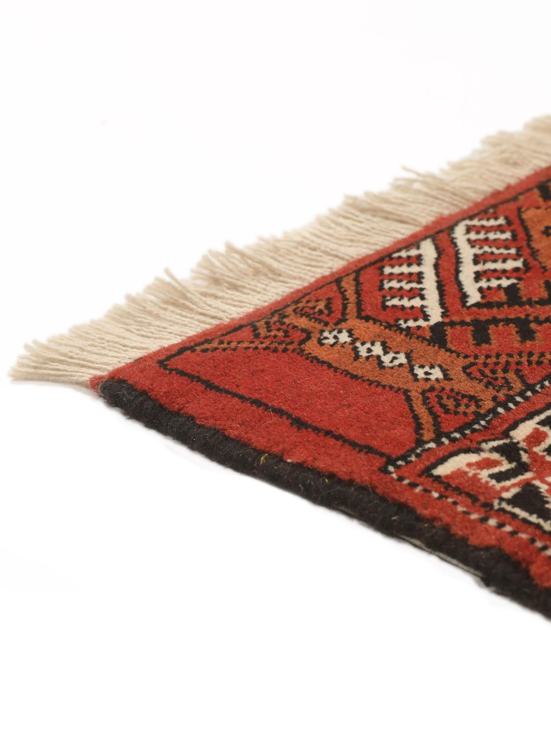 Hand-knotted Turkaman rug from the Middle East in red and beige tones.