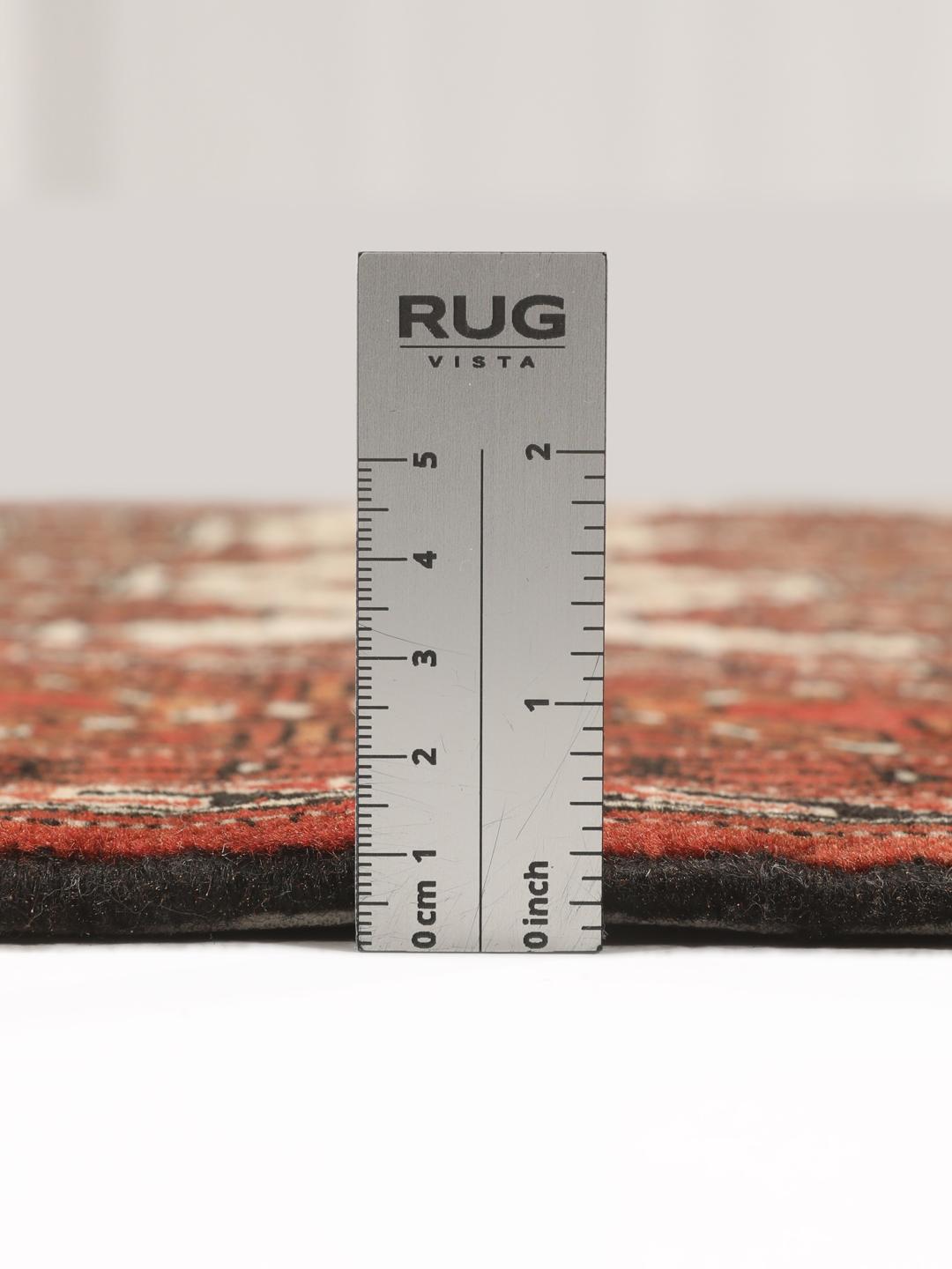 Hand-knotted Turkaman rug from the Middle East in red and beige tones.