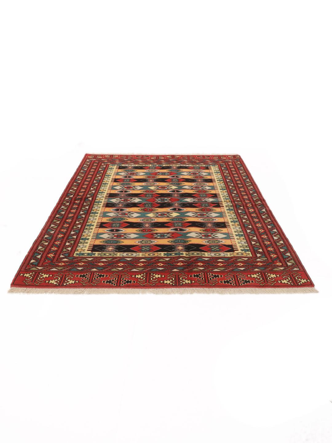 A hand-knotted Turkaman rug from the Middle East with a red base and geometric patterns.