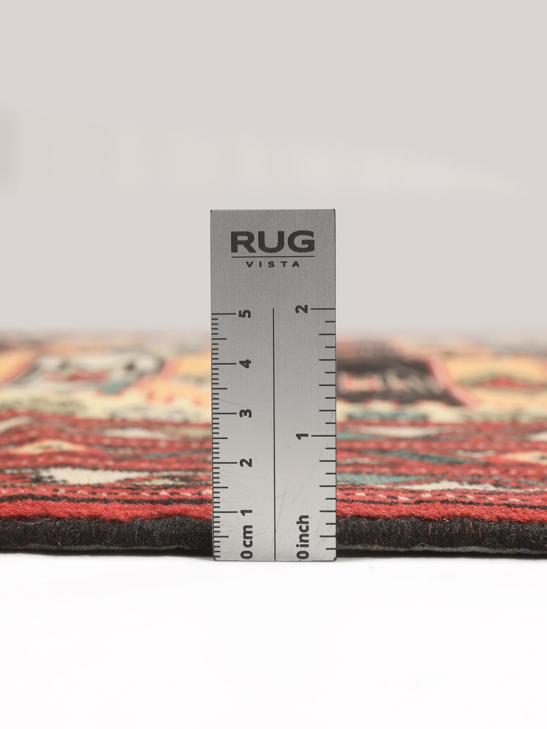 A hand-knotted Turkaman rug from the Middle East with a red base and geometric patterns.