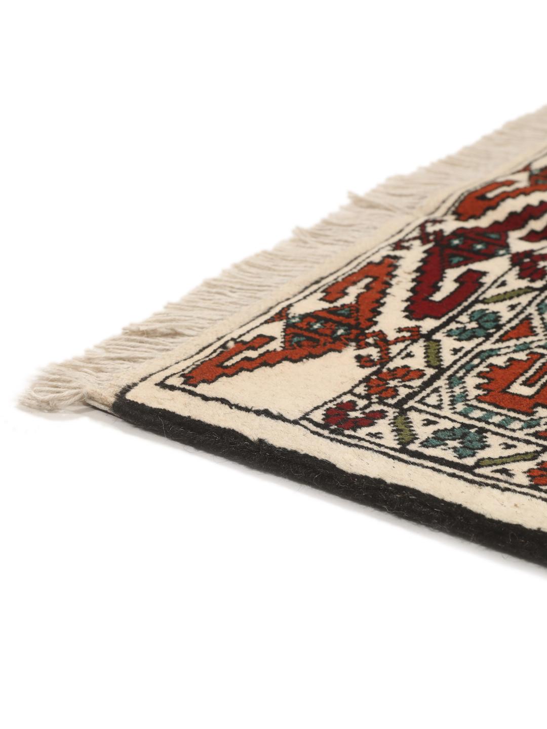 Hand-knotted Turkaman rug from the Middle East with a beige background and traditional geometric motifs.